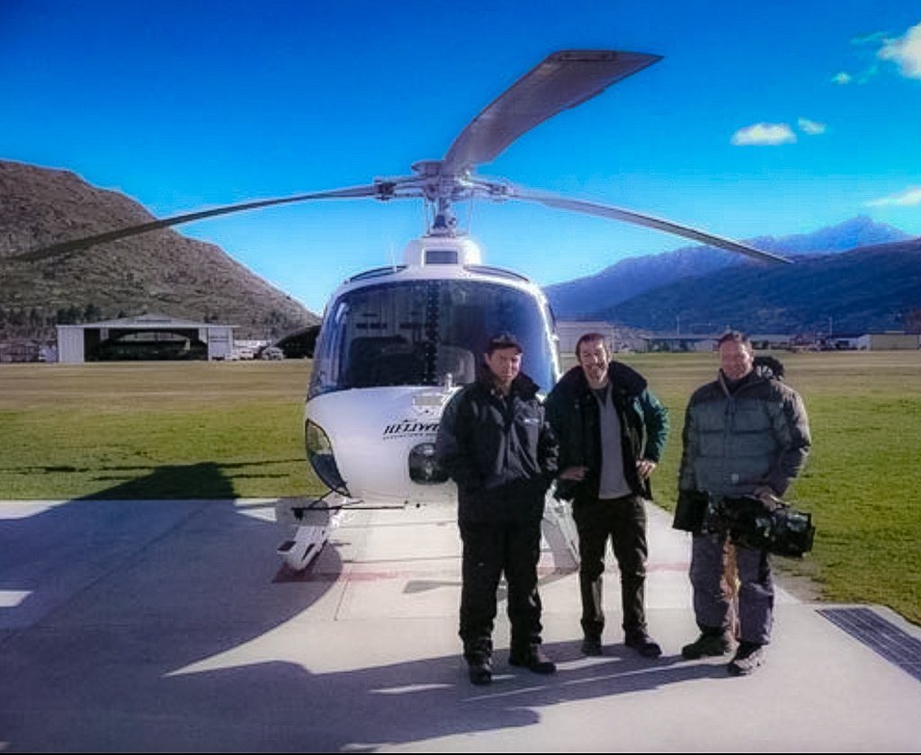 Andy McGrath and crew beside a helicopter before an aerial shoot in Queenstown